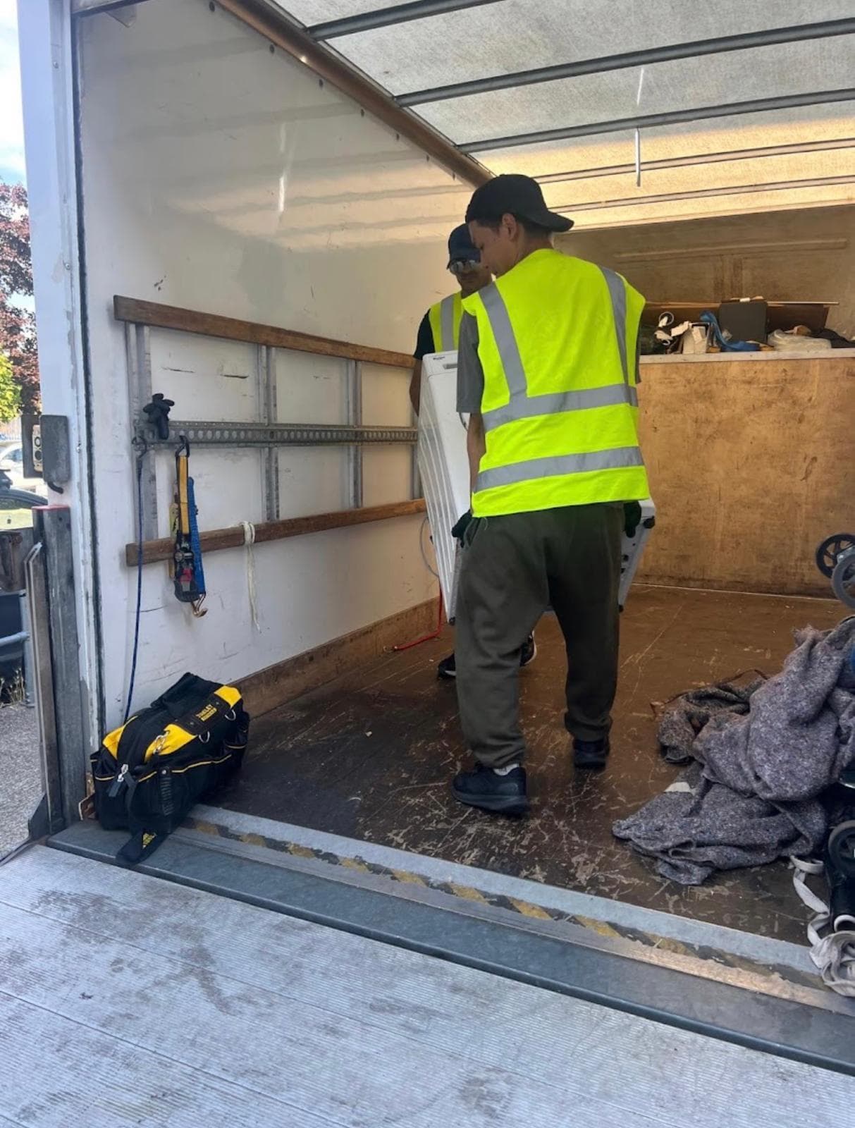 Local movers carrying boxes